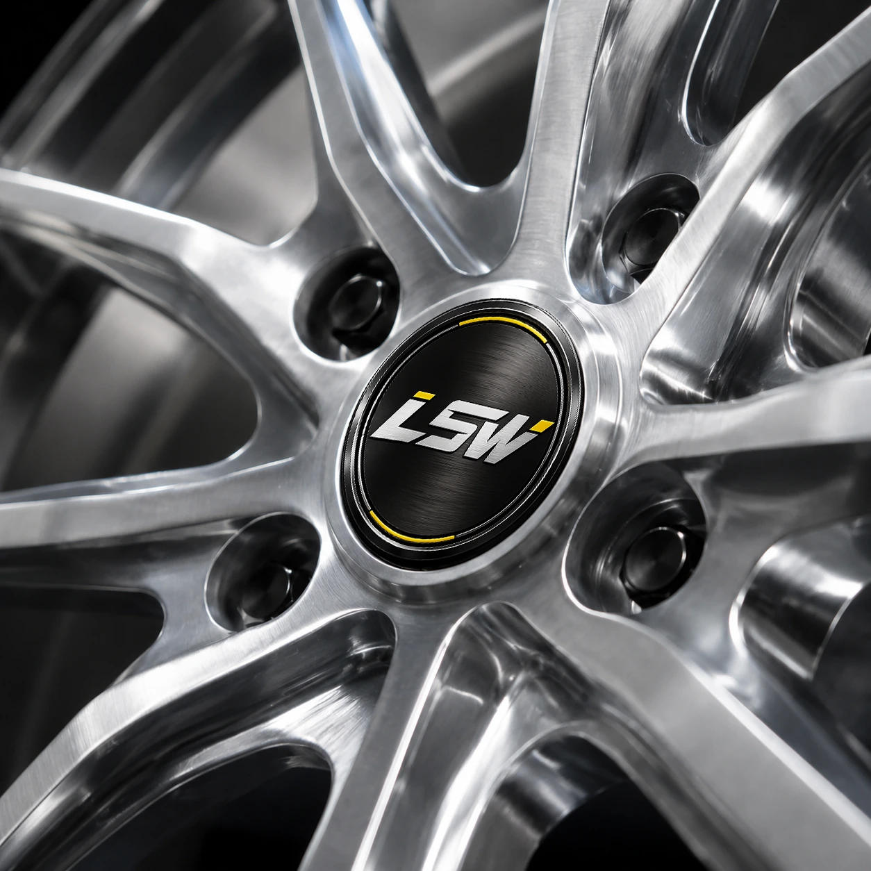 LSW brushed silver forged wheels, close-up view of black brand center cap, yellow decorative lines and silver logo are clearly visible